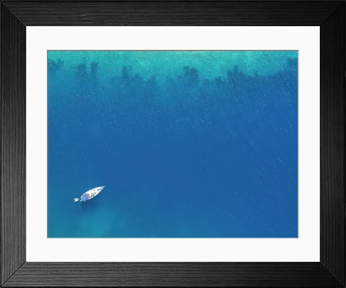 Framed Print : A sail boat in bright blue Mediterranean waters near Skopelos Framed Print : A sail boat in bright blue Mediterranean waters near Skopelos