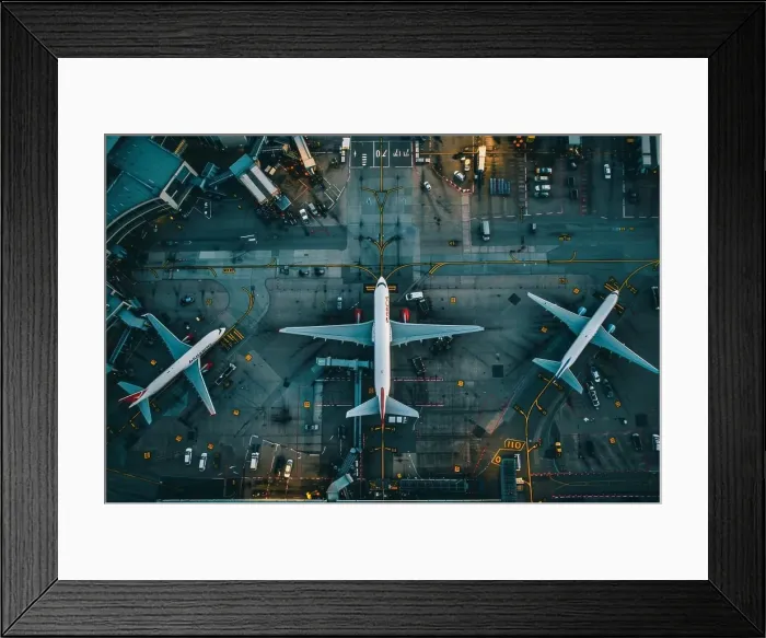 Framed Print : Aerial view of busy airport with planes taking off and landing representing dynamics of air travel Framed Print : Aerial view of busy airport with planes taking off and landing representing dynamics of air travel