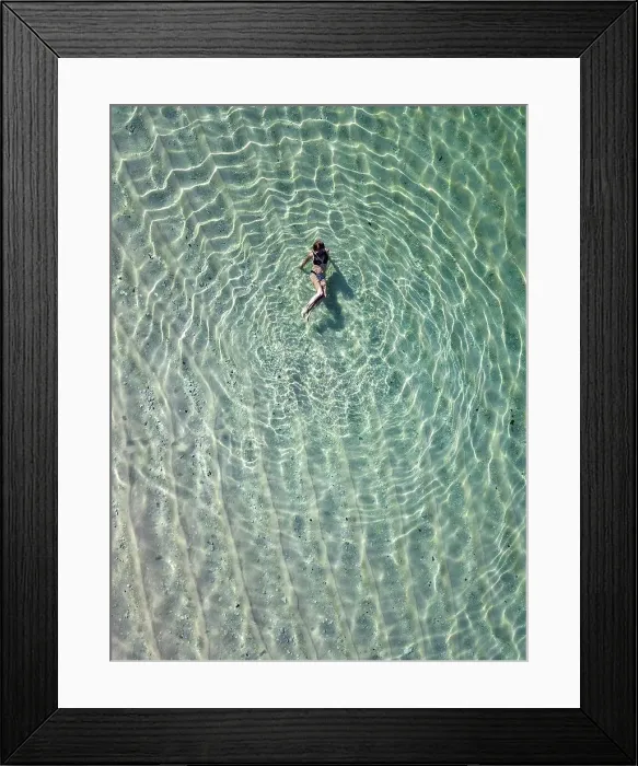 Framed Print : Indonesia, Bali, Melasti, Aerial view of Karma Kandara beach, woman in water Framed Print : Indonesia, Bali, Melasti, Aerial view of Karma Kandara beach, woman in water