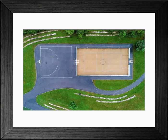 Framed Print : Young woman playing basketball, aerial view Framed Print : Young woman playing basketball, aerial view