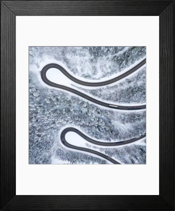 Framed Print : Winter snow winding road Serpentine Switchbacks forest woods season aerial photo view square drone