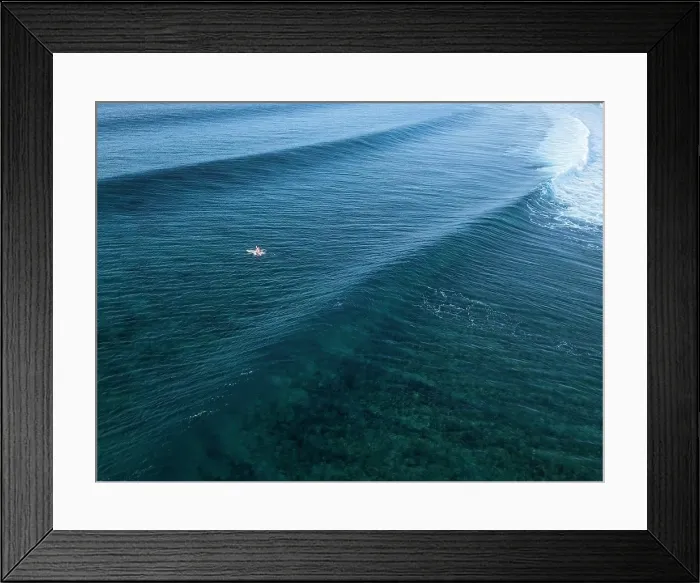 Framed Print : Aerial view of surfers in an ocean Framed Print : Aerial view of surfers in an ocean