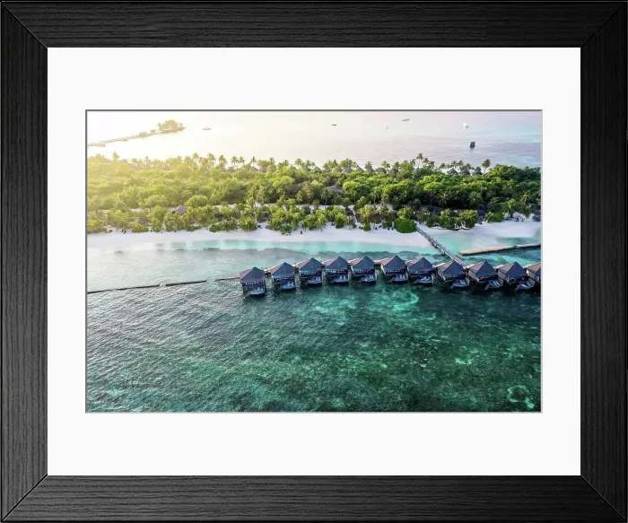 Framed Print : Maldives, Lhaviyani Atoll, Kuredu, Aerial view of coastal beach and row of resort bungalows Framed Print : Maldives, Lhaviyani Atoll, Kuredu, Aerial view of coastal beach and row of resort bungalows