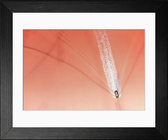 Framed Print : Extraction of salt on the pink lake using a special train