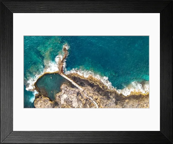 Framed Print : aerial view of natural pool near to the alantic ocean with 3 person Framed Print : aerial view of natural pool near to the alantic ocean with 3 person
