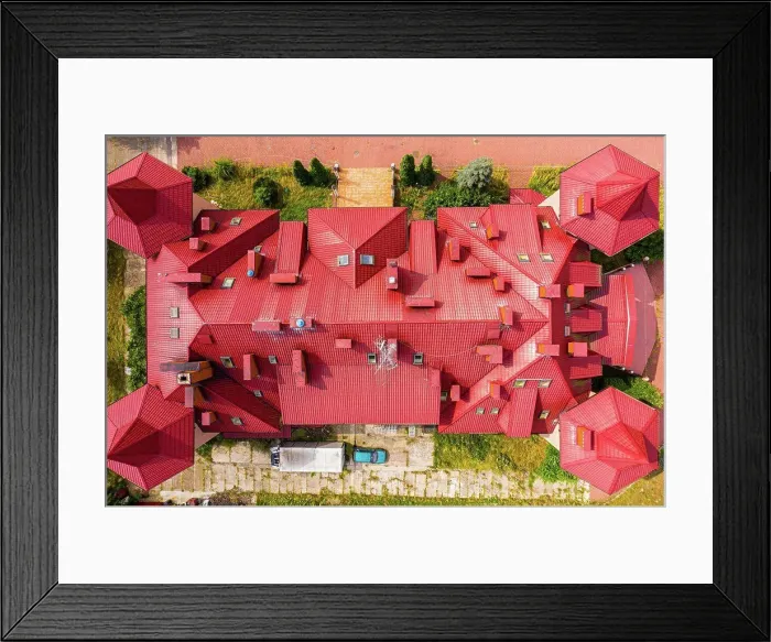 Framed Print : Top aerial view of building complex shingle roof construction. A Framed Print : Top aerial view of building complex shingle roof construction. A
