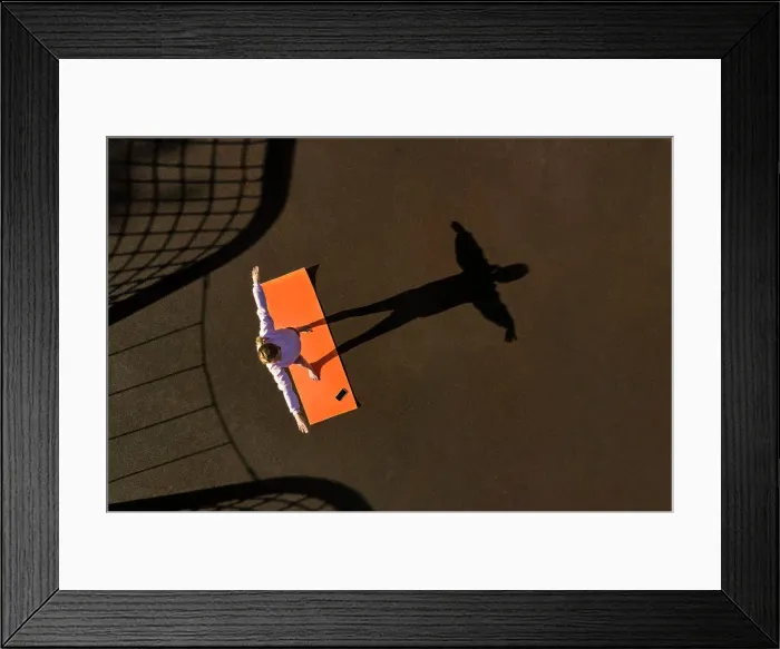 Framed Print : Woman practicing yoga, Aerial view Framed Print : Woman practicing yoga, Aerial view