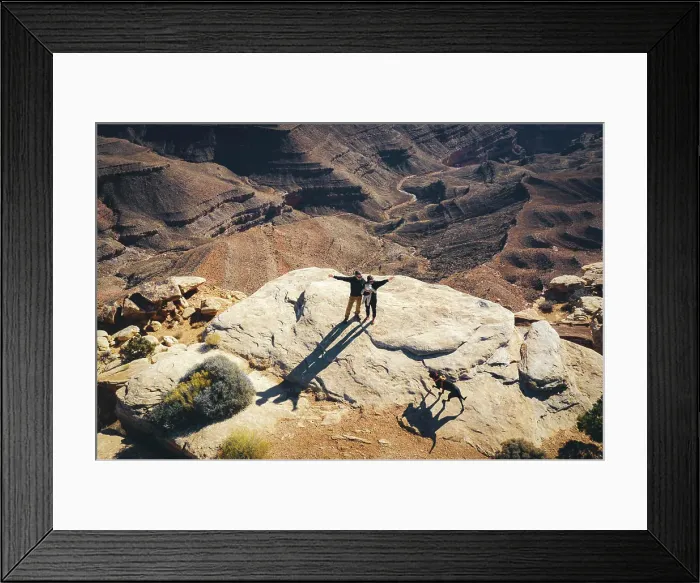 Framed Print : Aerial view of a family standing on a cliff of a Utah canyon
