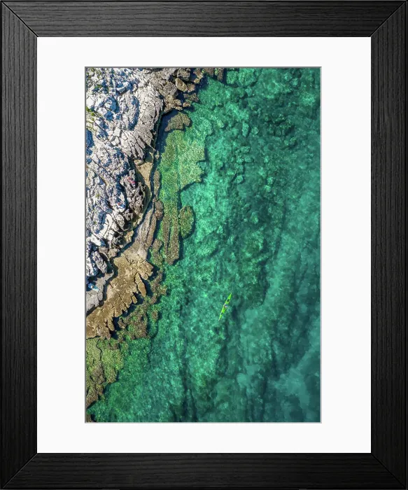 Framed Print : Aerial view of a kayak in the turquoise waters of Bale, Croatia Framed Print : Aerial view of a kayak in the turquoise waters of Bale, Croatia