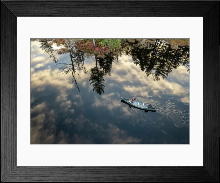 Framed Print : aerial view of couple navigating canoe across swamp in Maine woods