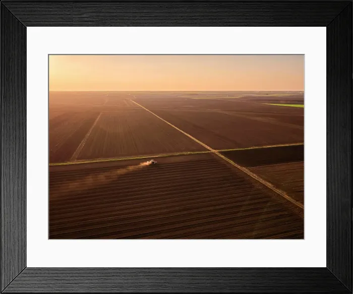 Framed Print : Serbia, VojvodinaProvince, Aerial view of tractor sowing seeds at dusk Framed Print : Serbia, VojvodinaProvince, Aerial view of tractor sowing seeds at dusk