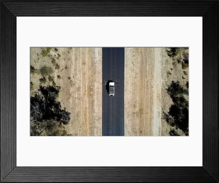Framed Print : Namibia, Aerial view of man and woman resting in middle of¶ÿNational Road B15 Framed Print : Namibia, Aerial view of man and woman resting in middle of¶ÿNational Road B15