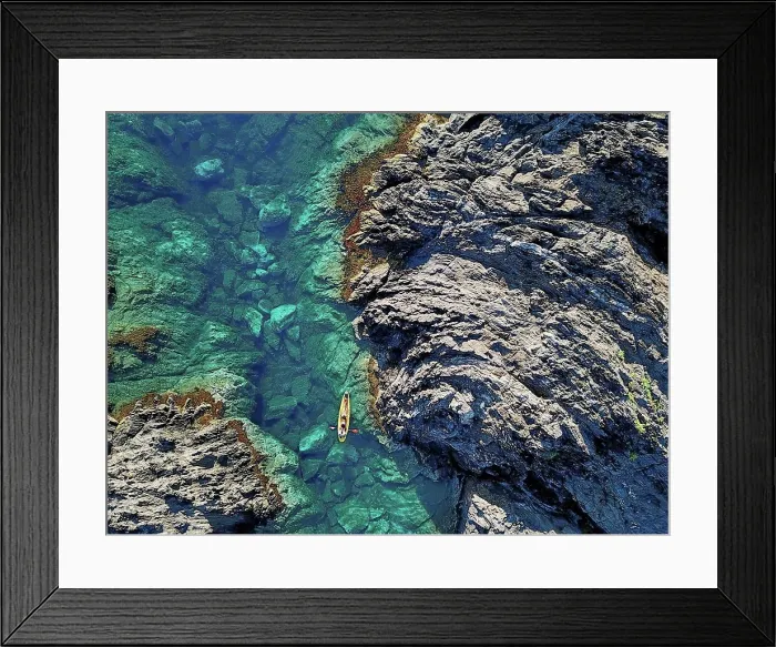 Framed Print : Spain, Catalonia, Costa Brava, Aerial view of man in kayak near rocky coast Framed Print : Spain, Catalonia, Costa Brava, Aerial view of man in kayak near rocky coast