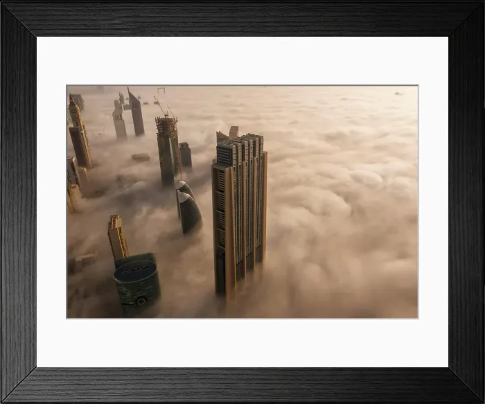 Framed Print : Aerial view of buildings surrounded by clouds Dubai, United Arab Emirates Framed Print : Aerial view of buildings surrounded by clouds Dubai, United Arab Emirates