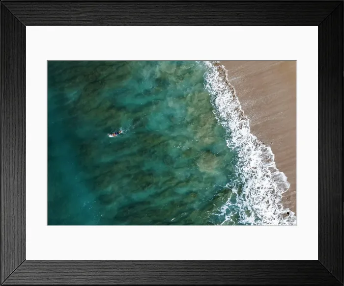 Framed Print : Male surfer paddles on board on Oahu, Hawaii Framed Print : Male surfer paddles on board on Oahu, Hawaii