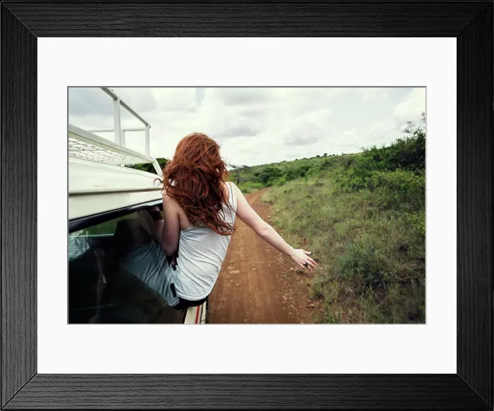 Framed Print : Woman sitting on door of vehicle in wildlife park, Nairobi, Kenya Framed Print : Woman sitting on door of vehicle in wildlife park, Nairobi, Kenya
