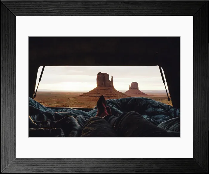 Framed Print : Male legs and feet relaxing inside four wheel drive with view of sandstone buttes from car boot Framed Print : Male legs and feet relaxing inside four wheel drive with view of sandstone buttes from car boot