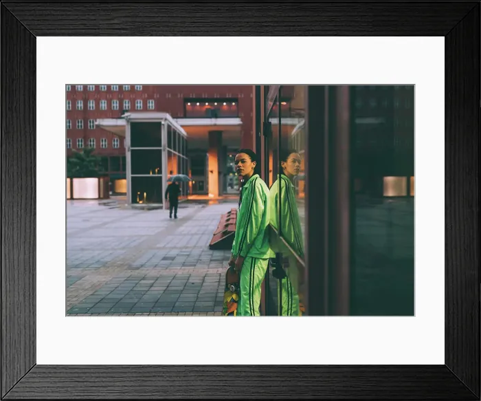 Framed Print : Woman leaning against glass window, Milan, Italy Framed Print : Woman leaning against glass window, Milan, Italy