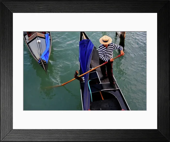 Framed Print : Gondolier Rowing A Gondola On Canal In Venice, Italy, Europe Framed Print : Gondolier Rowing A Gondola On Canal In Venice, Italy, Europe