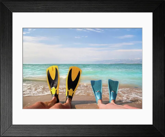 Framed Print : Croatia, Zadar, Couple with flippers relaxing on beach Framed Print : Croatia, Zadar, Couple with flippers relaxing on beach