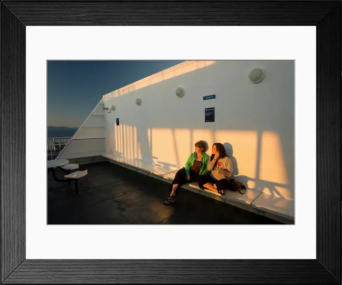 Framed Print : Mother and Daughter share a moment together alongside the setting sun while aboard BC Ferry bound for Vancouver Framed Print : Mother and Daughter share a moment together alongside the setting sun while aboard BC Ferry bound for Vancouver