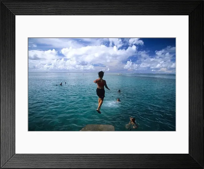 Framed Print : Children jumping into the water at Point Venus, Tahiti, French Polynesia, south sea Framed Print : Children jumping into the water at Point Venus, Tahiti, French Polynesia, south sea