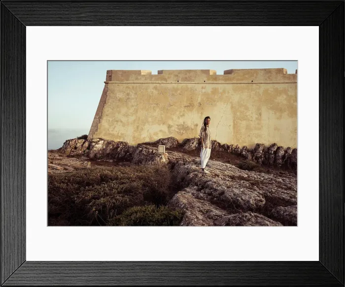 Framed Print : androgynous person stands in front of historic fort in Portugal Framed Print : androgynous person stands in front of historic fort in Portugal