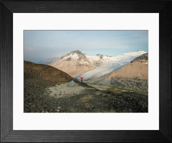 Framed Print : hiker raises hands in the air, overjoyed by view Framed Print : hiker raises hands in the air, overjoyed by view