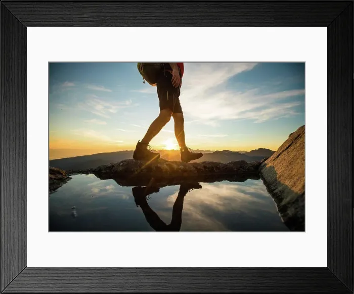 Framed Print : Lower half of backpacker walking on summit ridge