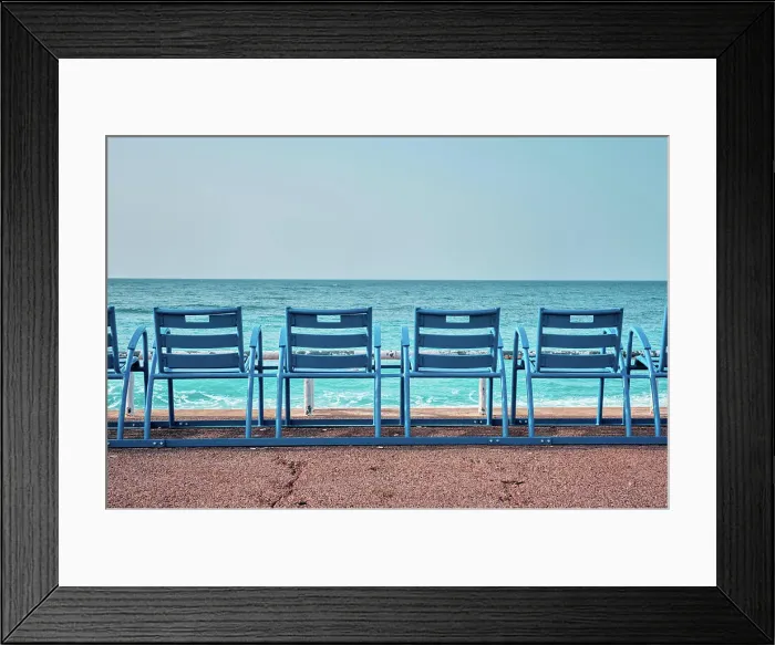 Framed Print : Famous blue chairs bench on beach in the morning. Nice, France Framed Print : Famous blue chairs bench on beach in the morning. Nice, France