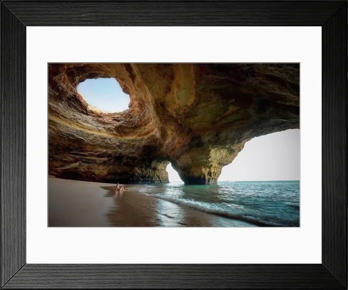 Framed Print : Portugal, beach of Benagil, cave, woman sitting at seafront Framed Print : Portugal, beach of Benagil, cave, woman sitting at seafront