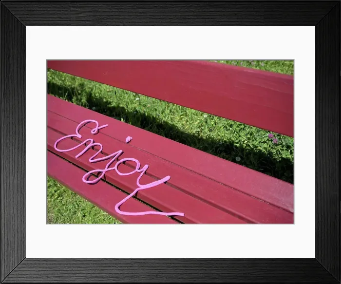 Framed Print : Word enjoy on a bench