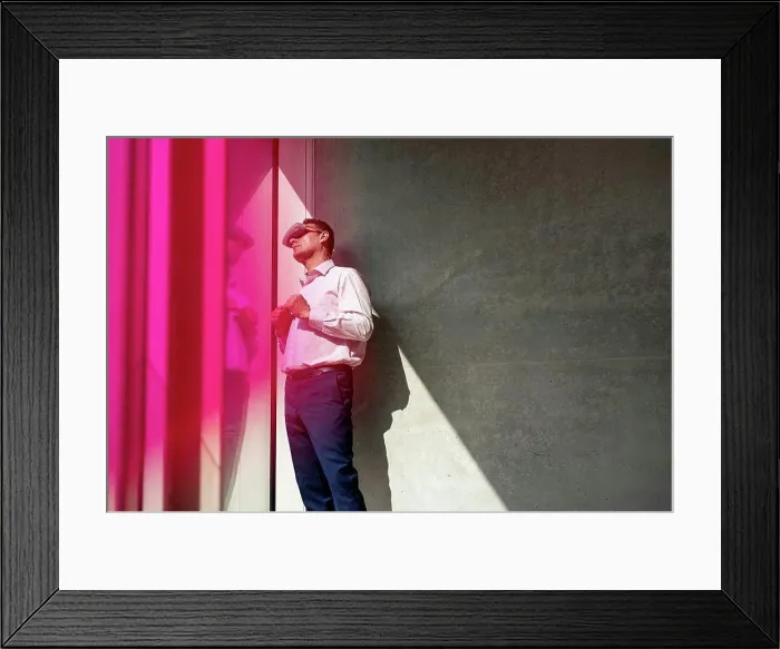 Framed Print : Mature businessman watching through futuristic glasses in office