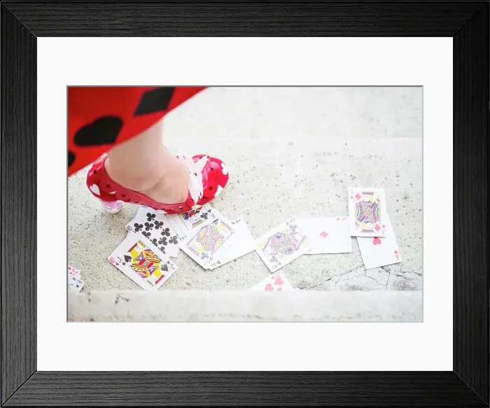 Framed Print : Red high heel standing on the playing card