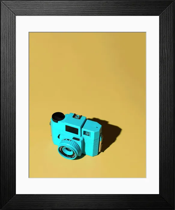 Framed Print : Blue Camera on Yellow Background