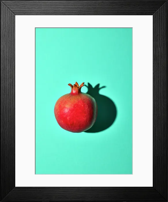 Framed Print : Pomegranate on turquoise background