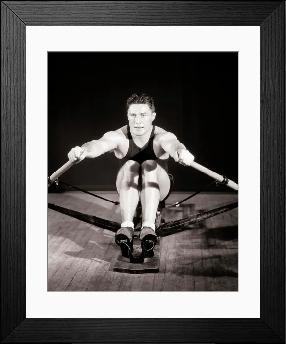 Framed Print : 1930s MAN MUSCULAR ATHLETE CONCENTRATED FOCUSED FACIAL EXPRESSION EXERCISING WORKING OUT ON GYMNASIUM STATIONARY ROWING Framed Print : 1930s MAN MUSCULAR ATHLETE CONCENTRATED FOCUSED FACIAL EXPRESSION EXERCISING WORKING OUT ON GYMNASIUM STATIONARY ROWING