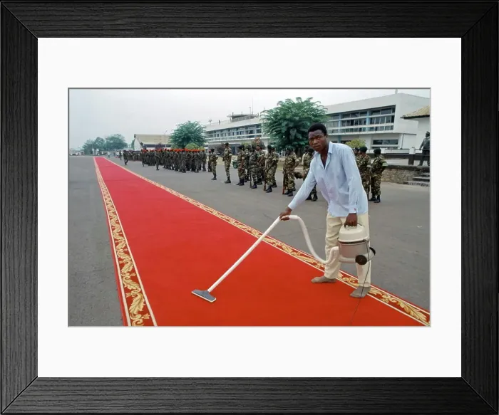 Framed Print : Red carpet being cleaned ready for VIP arrival in Cameroon, West Africa Framed Print : Red carpet being cleaned ready for VIP arrival in Cameroon, West Africa