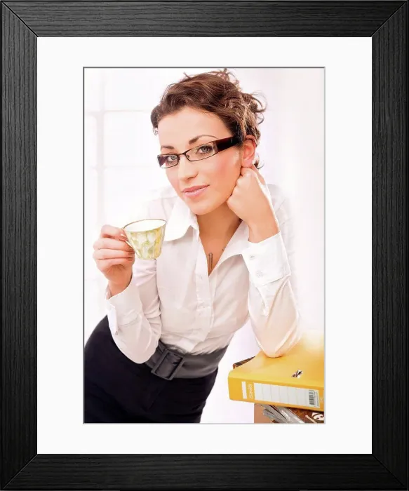 Framed Print : A businesswoman drinking coffee, thinking Framed Print : A businesswoman drinking coffee, thinking