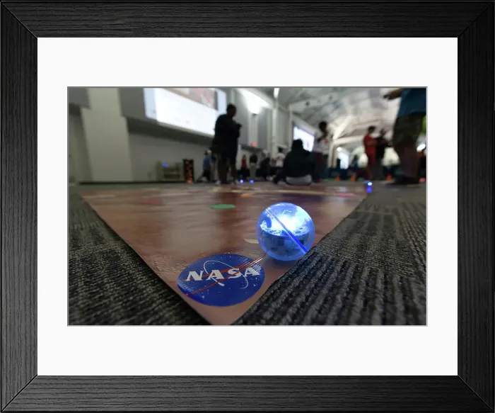 Framed Print : A programmable off-the-shelf Sphero robot is shown on a Mars mat at the Center for Space Education at NASA's Kennedy Framed Print : A programmable off-the-shelf Sphero robot is shown on a Mars mat at the Center for Space Education at NASA's Kennedy
