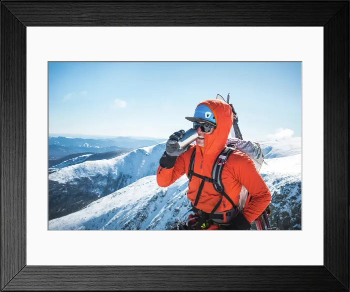 Framed Print : Ski mountaineer taking a break and drinking a hot beverage Framed Print : Ski mountaineer taking a break and drinking a hot beverage