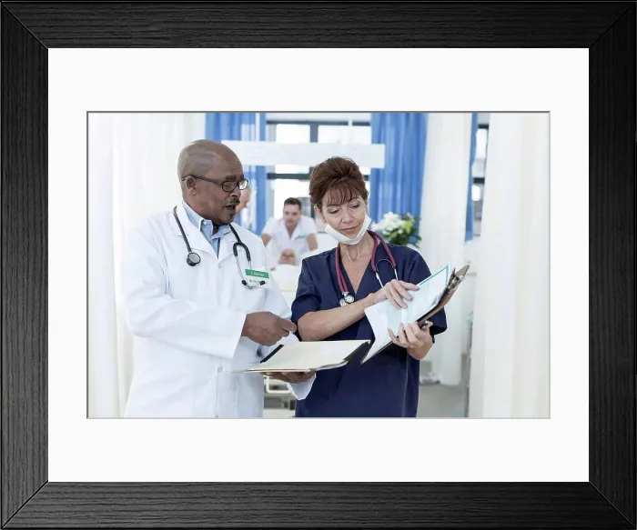 Framed Print : Two doctors in hospital talking
