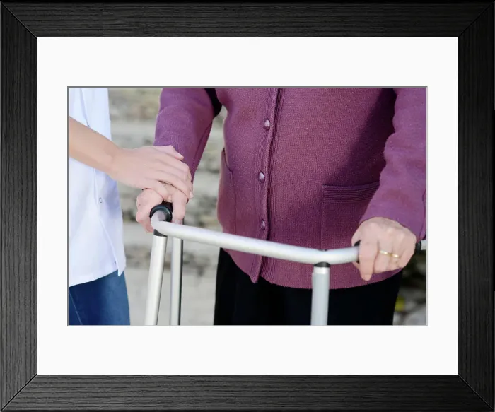 Framed Print : Elderly senior woman with a nurse hands detail