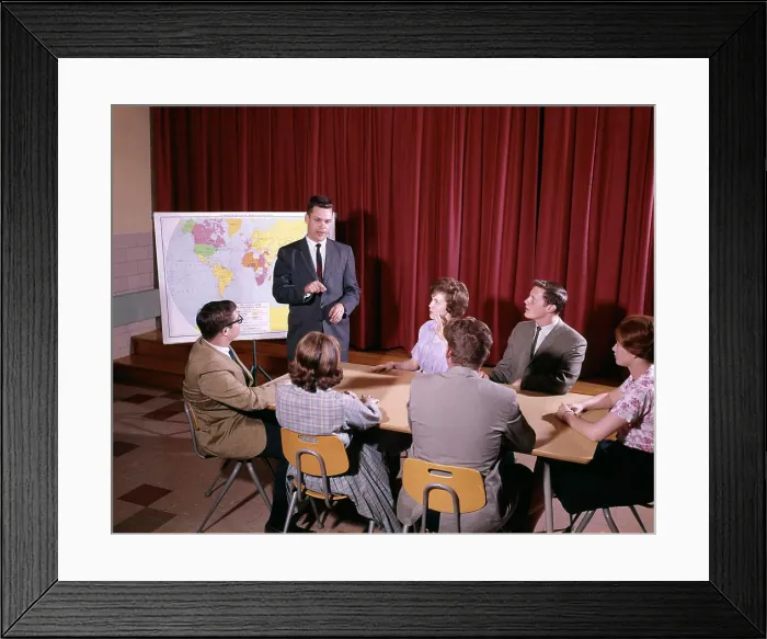 Framed Print : 1960S Group Of Students Around Table Teacher Standing By Map Framed Print : 1960S Group Of Students Around Table Teacher Standing By Map