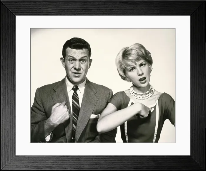 Framed Print : Portrait of a young couple pointing to themselves Framed Print : Portrait of a young couple pointing to themselves
