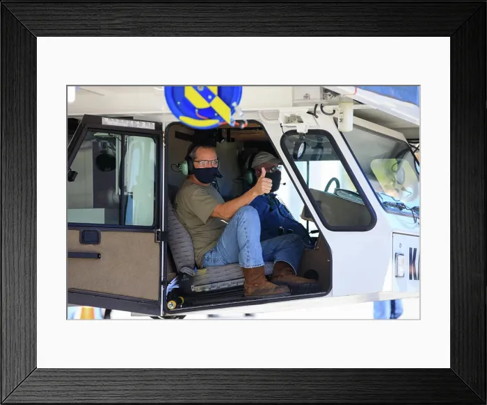 Framed Print : Ryan Kiechle of Jacobs Technology gives a thumbs-up inside the transporter with Orion secured atop as the spacecraft Framed Print : Ryan Kiechle of Jacobs Technology gives a thumbs-up inside the transporter with Orion secured atop as the spacecraft