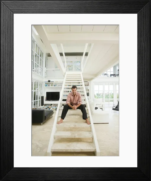 Framed Print : Hispanic man smiling on staircase Framed Print : Hispanic man smiling on staircase