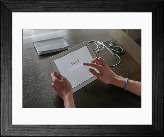Framed Print : Boy looking for Google information on a tablet Framed Print : Boy looking for Google information on a tablet