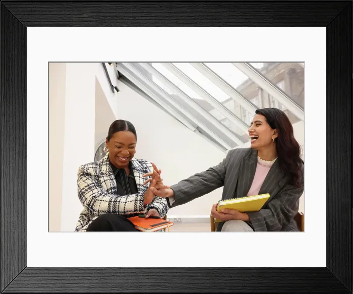 Framed Print : Businesswomen laughing in office Framed Print : Businesswomen laughing in office