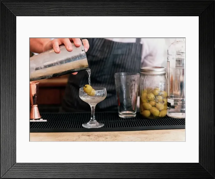 Framed Print : Close up of bartender pouring cocktail at cocktail bar Framed Print : Close up of bartender pouring cocktail at cocktail bar